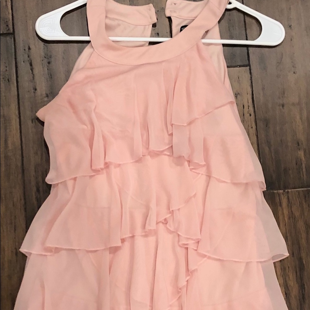 A light pink ruffled dress